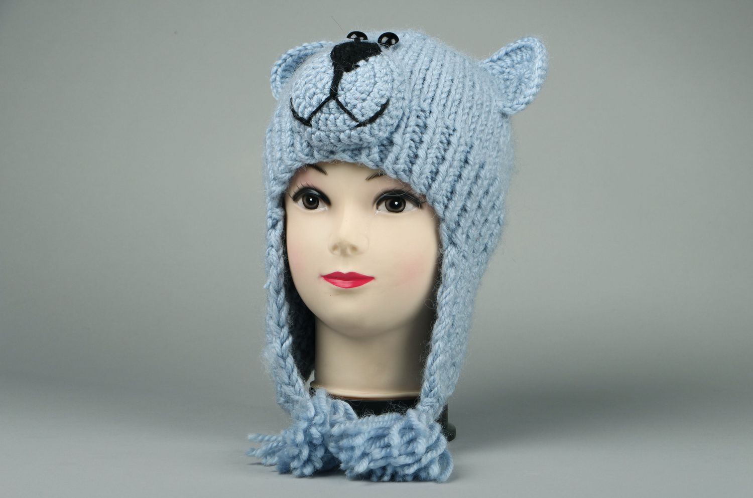 Knitted earflap hat made of semi-wool photo 2