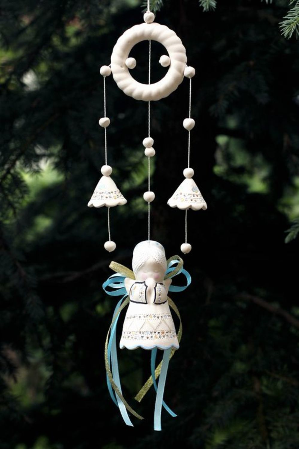 Hanging bells made from white clay photo 1