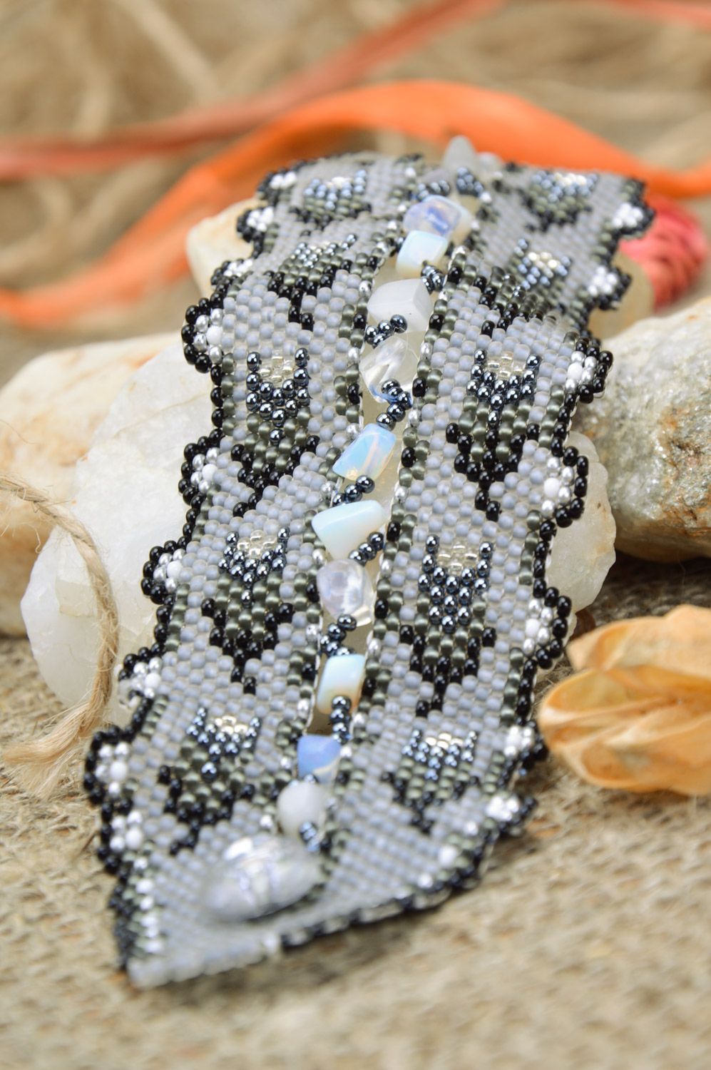 Beautiful handmade women's wide bracelet woven of beads of gray color photo 1