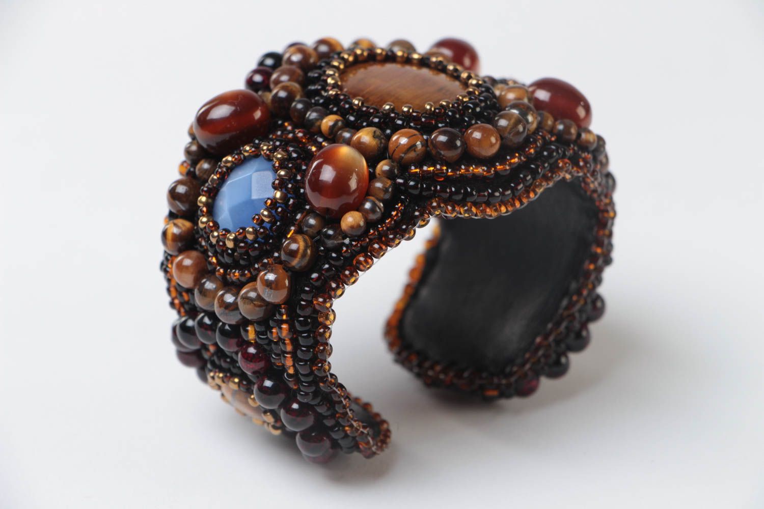 Beautiful handmade women's beaded bracelet with natural stones on leather basis photo 2
