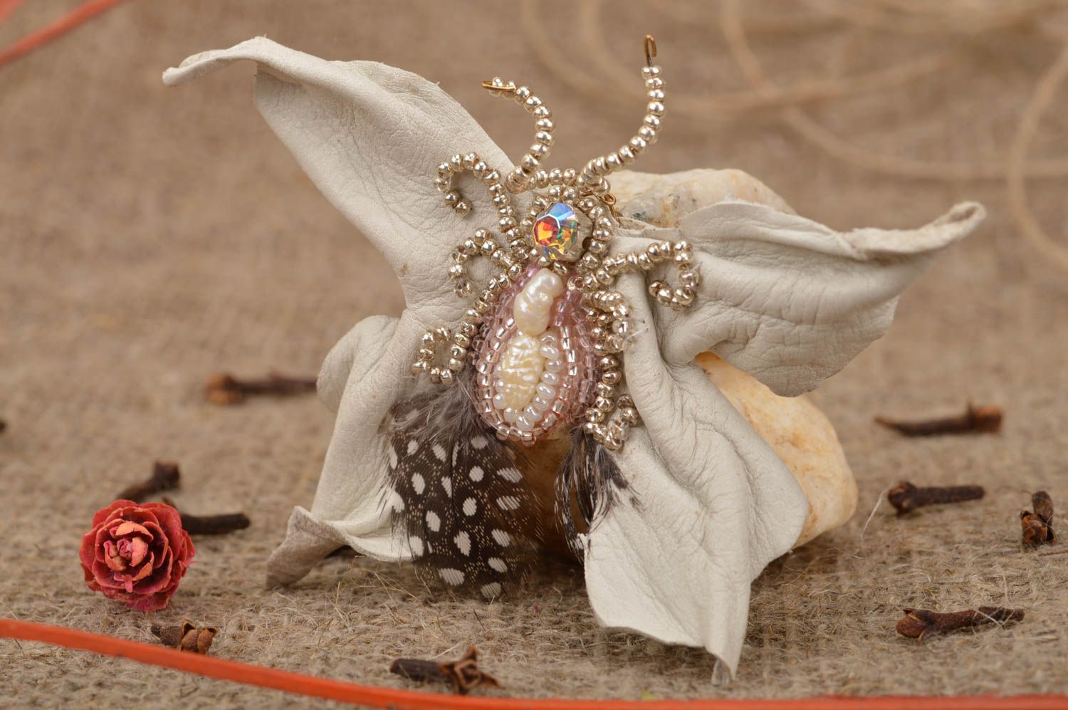 Beautiful handmade white leather brooch in shape of butterfly with feathers photo 1