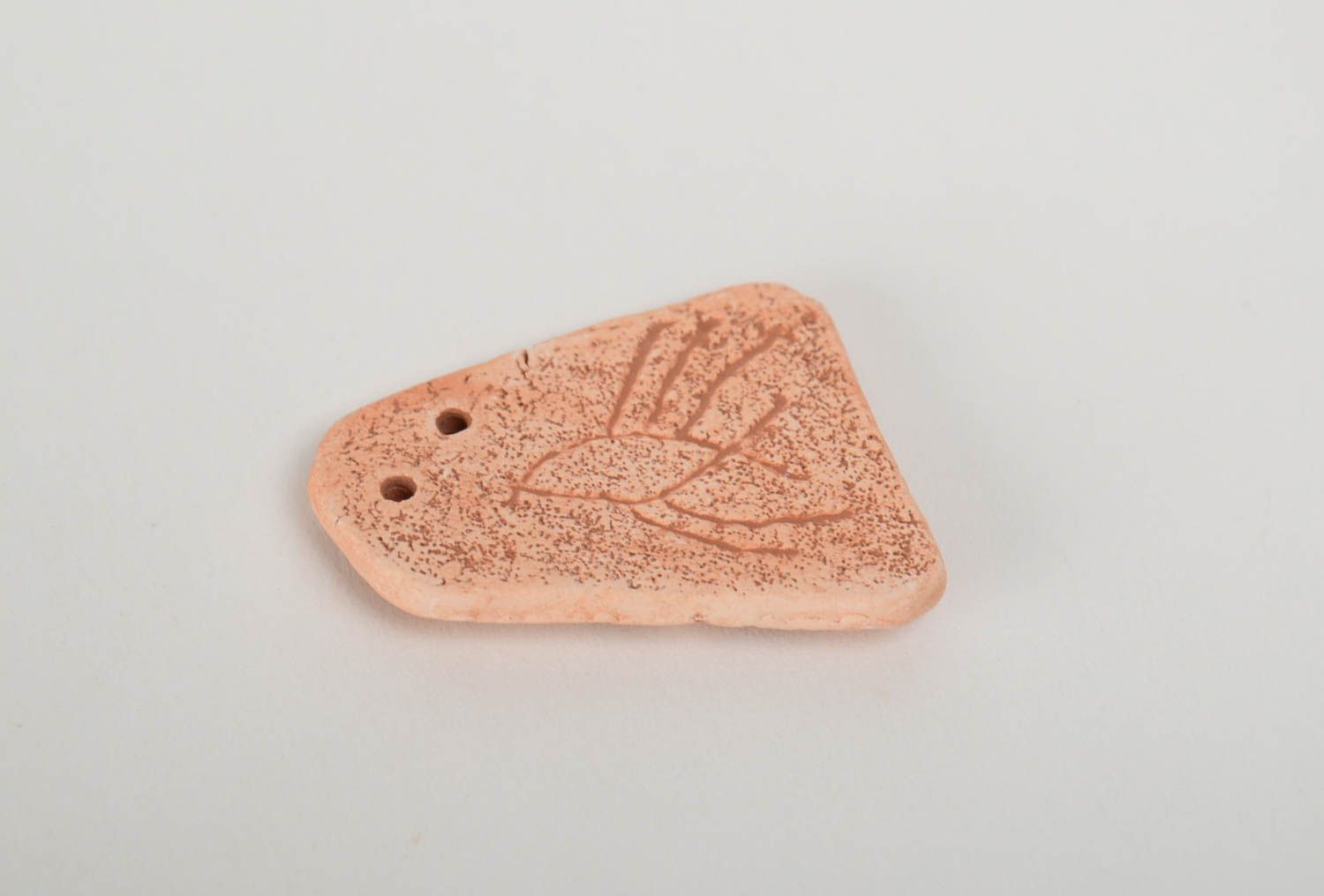 Handmade decorative flat ceramic blank pendant with wave shaped pattern photo 3