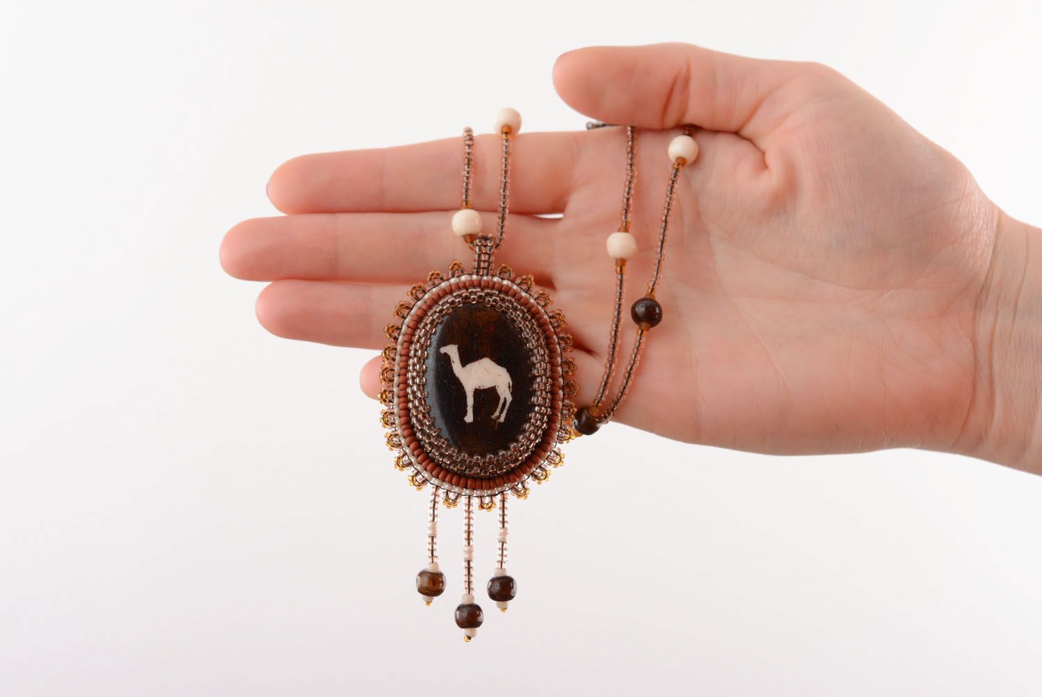 Beaded pendant with camel bone photo 5