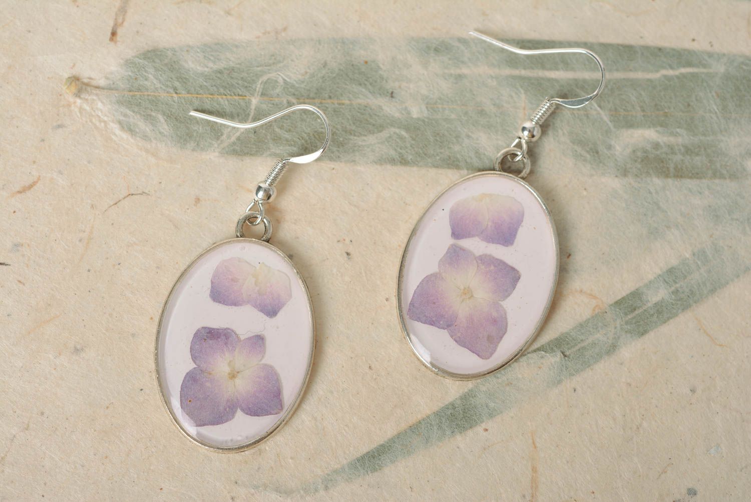 Unusual oval handmade earrings with dried flowers coated with epoxy photo 1