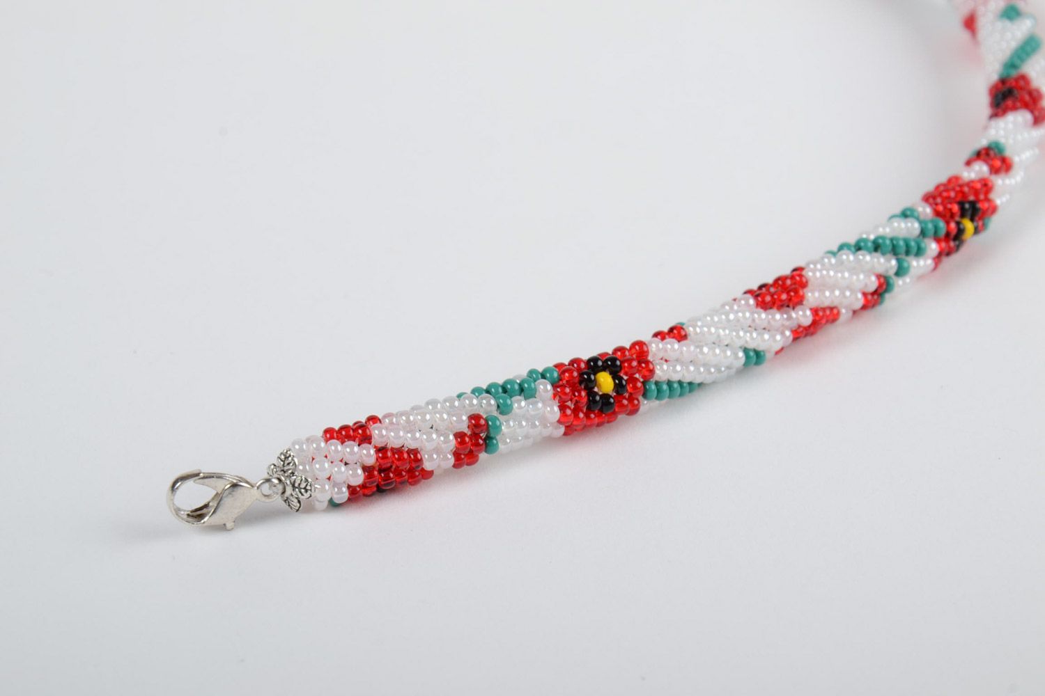 Festive white handmade beaded cord bracelet with floral motives photo 3