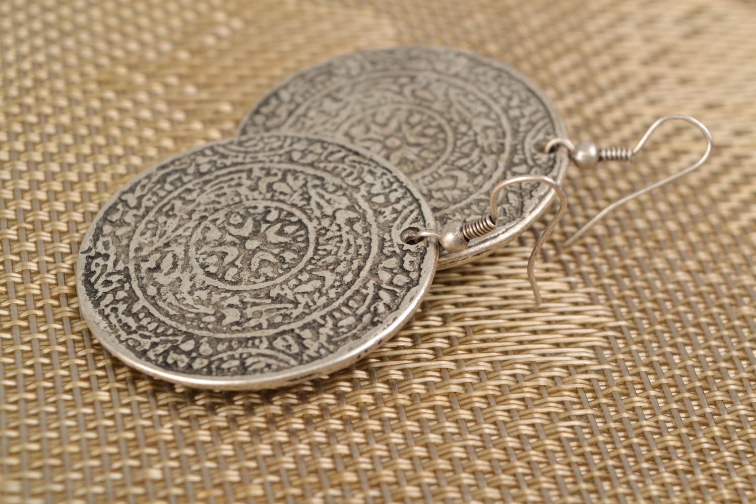 Round metal earrings with ethnic pattern photo 1
