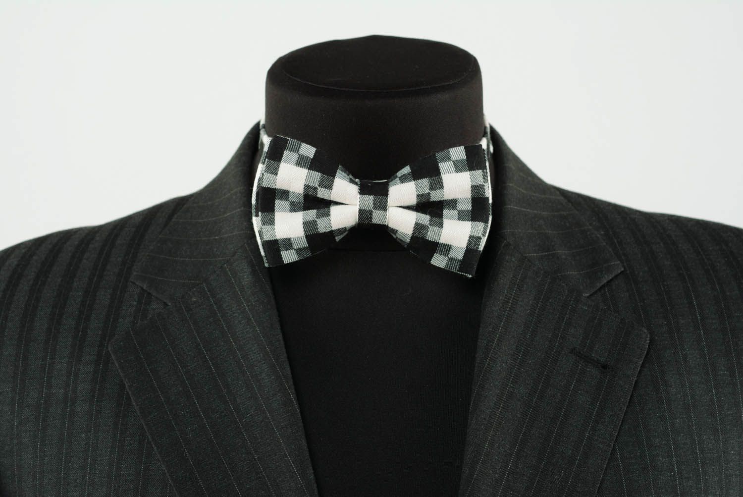 Checkered bow tie in black and white colors photo 2