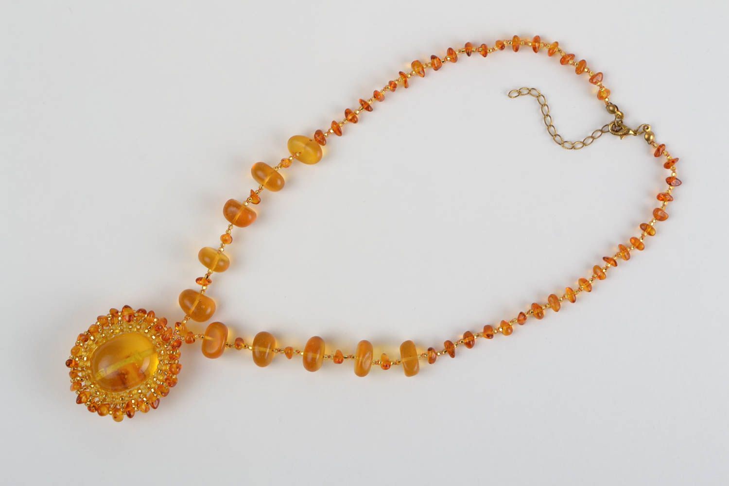 Handmade cute long pendant made of beads and natural stones of amber color photo 3