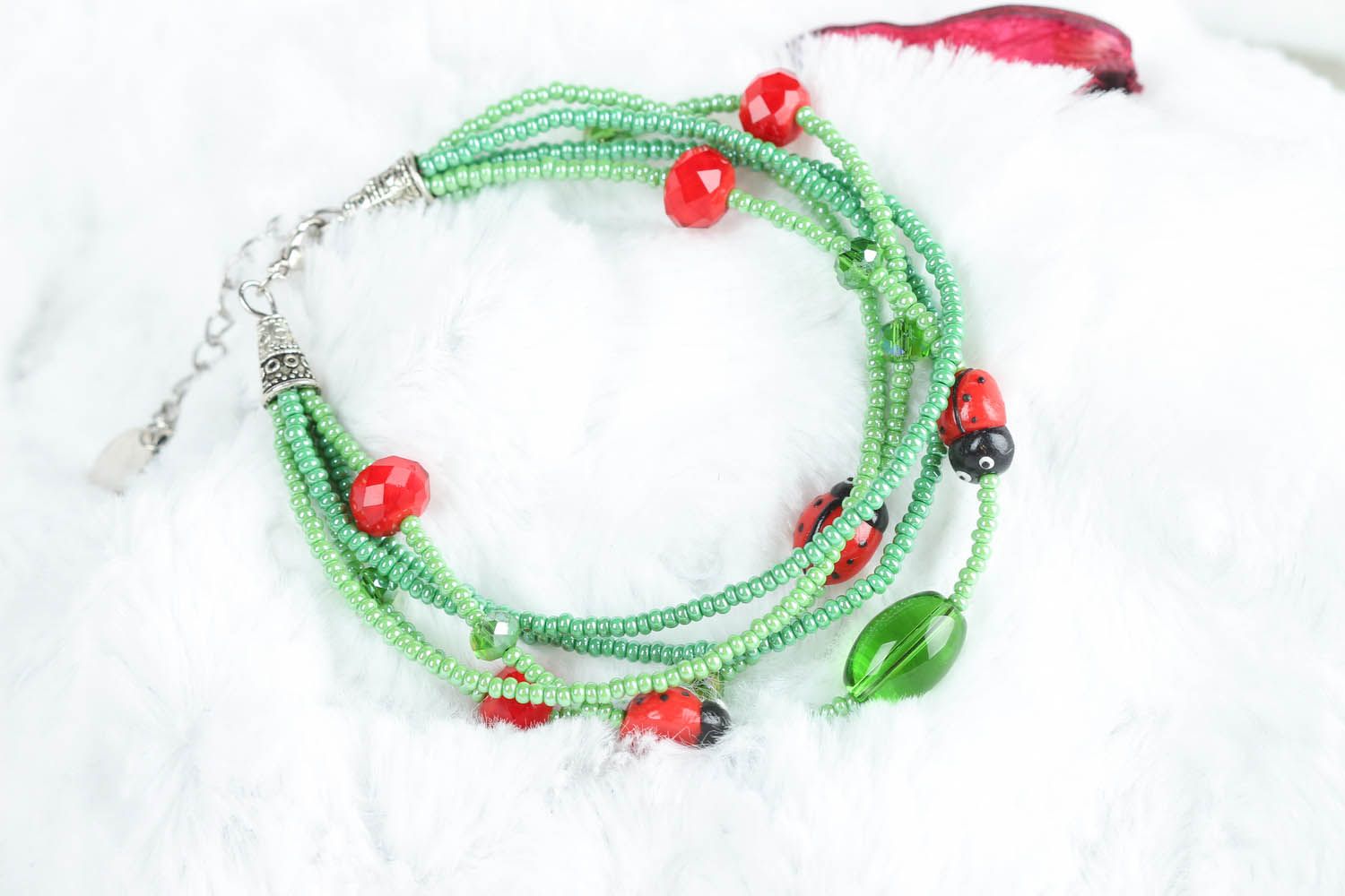 Green bracelet with ladybugs photo 4