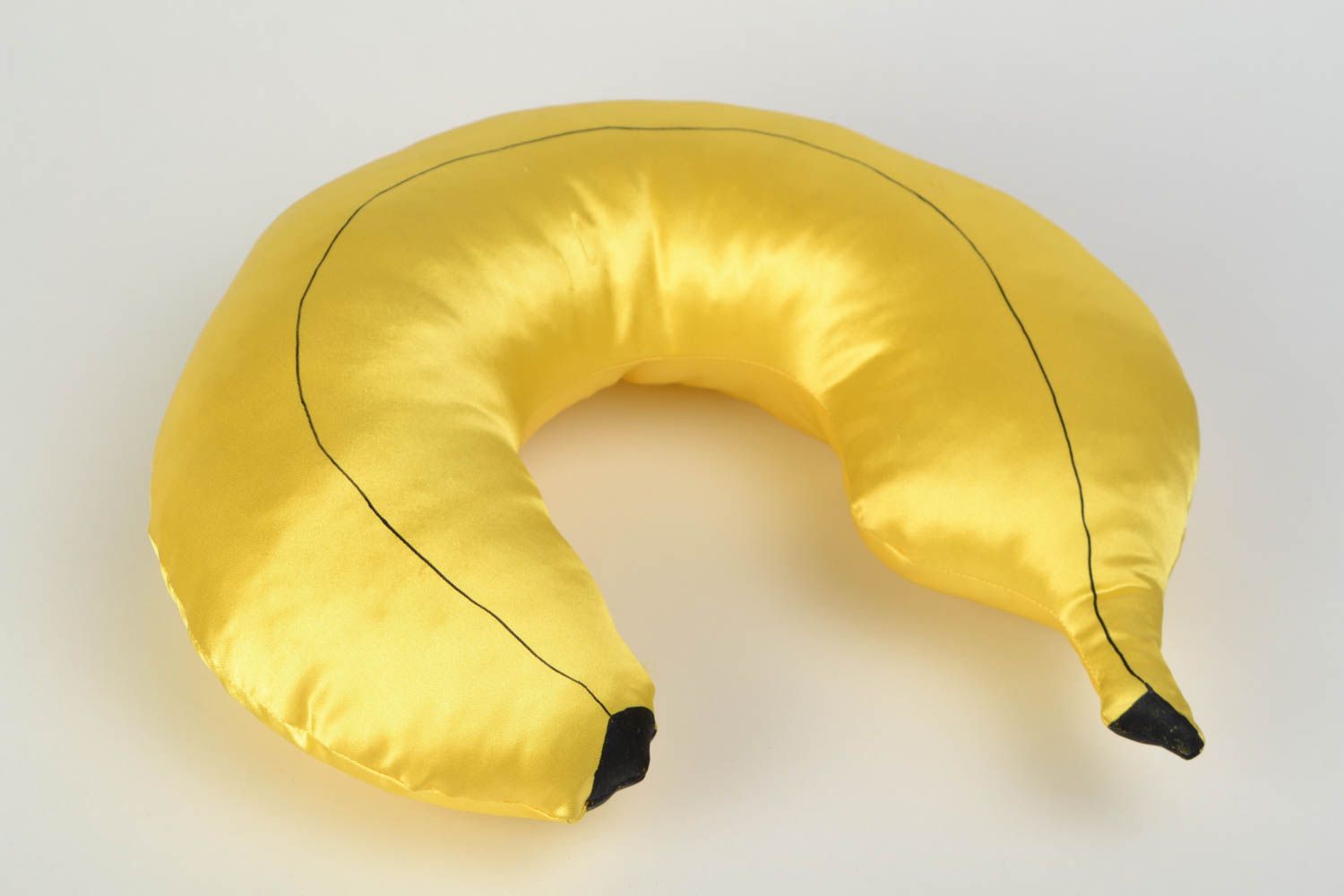 Handmade yellow satin travel pillow in the shape of banana photo 1