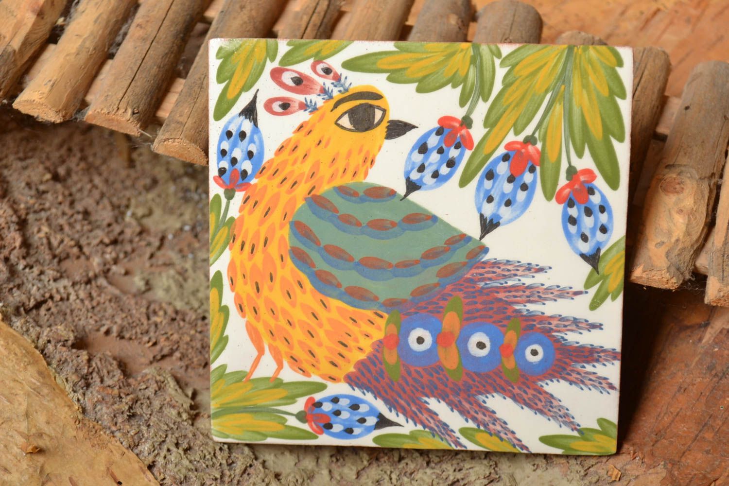 Handmade designer ceramic facing tile with colorful bird painted with engobes photo 1
