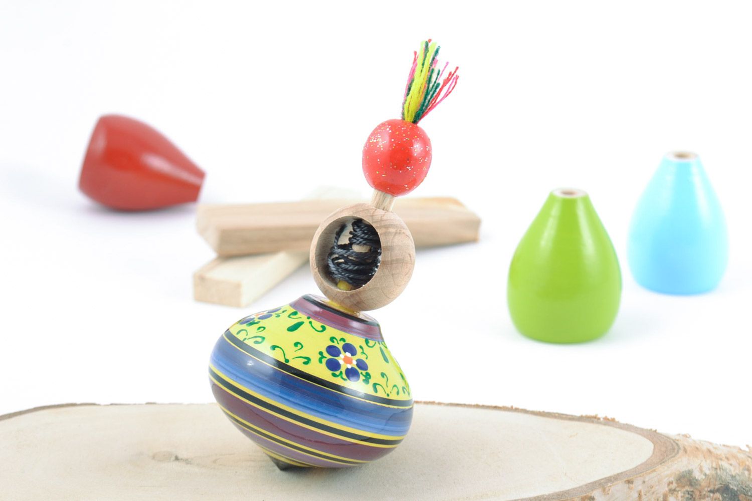 Handmade decorative spinning top with a ring for the development of fine motor skills of the baby photo 1