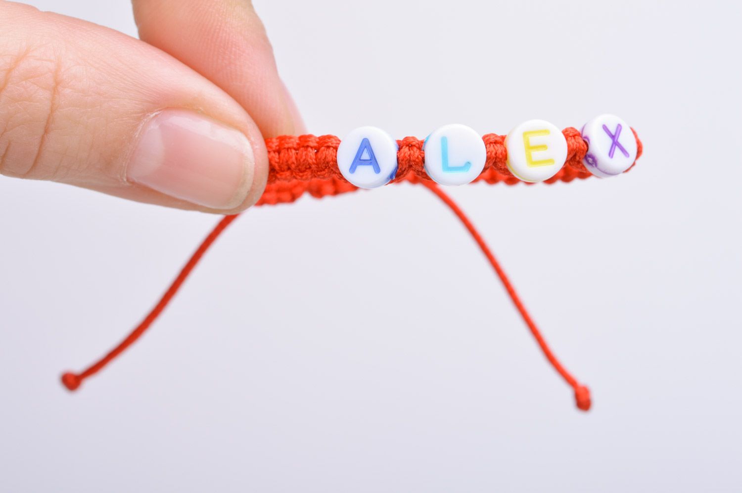 Handmade friendship name bracelet woven of red threads of adjustable size photo 3