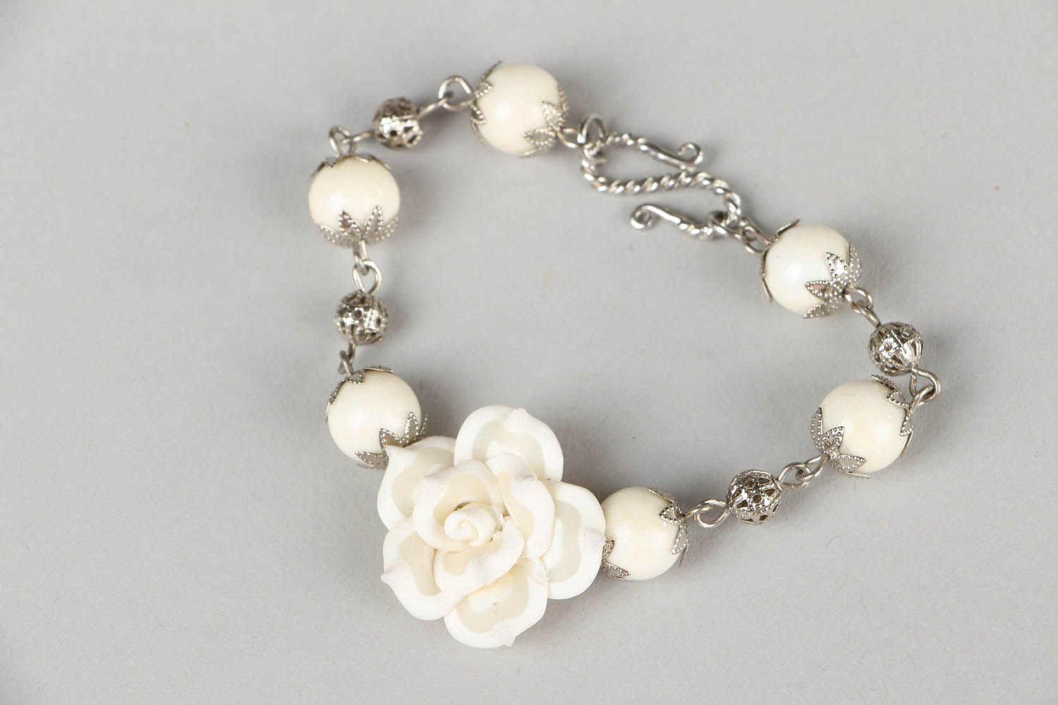 Bracelet with white flower photo 4