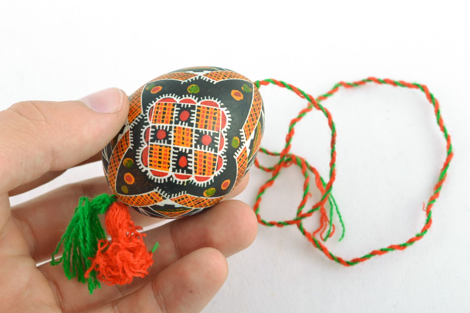 Handmade Easter egg painted with melted wax with tassels for home decoration photo 2