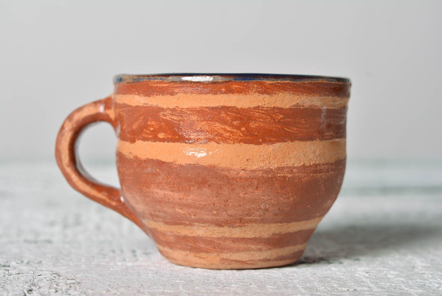 Village pottery style ceramic clay cup for coffee in light brown color with handle photo 1