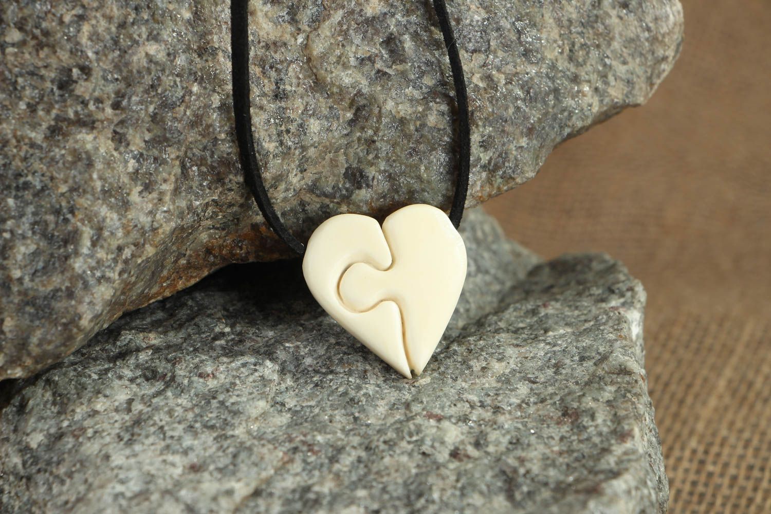 Heart shaped pendant carved of cow bone photo 4