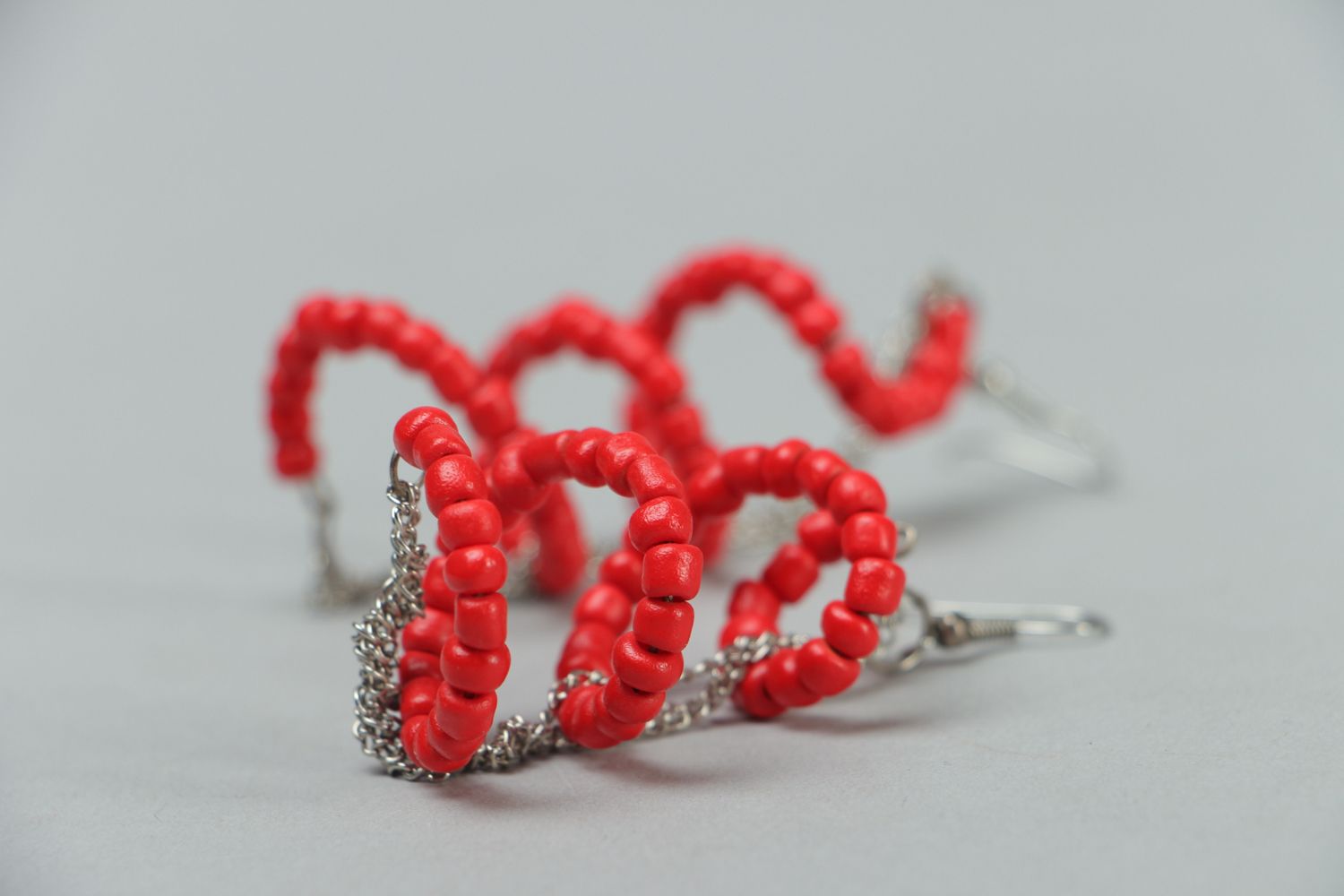 Long earrings with red plastic beads photo 2