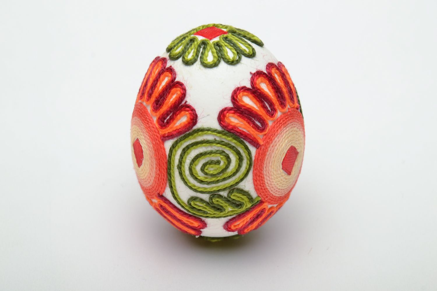 Bright handmade Easter egg decorated with threads photo 3