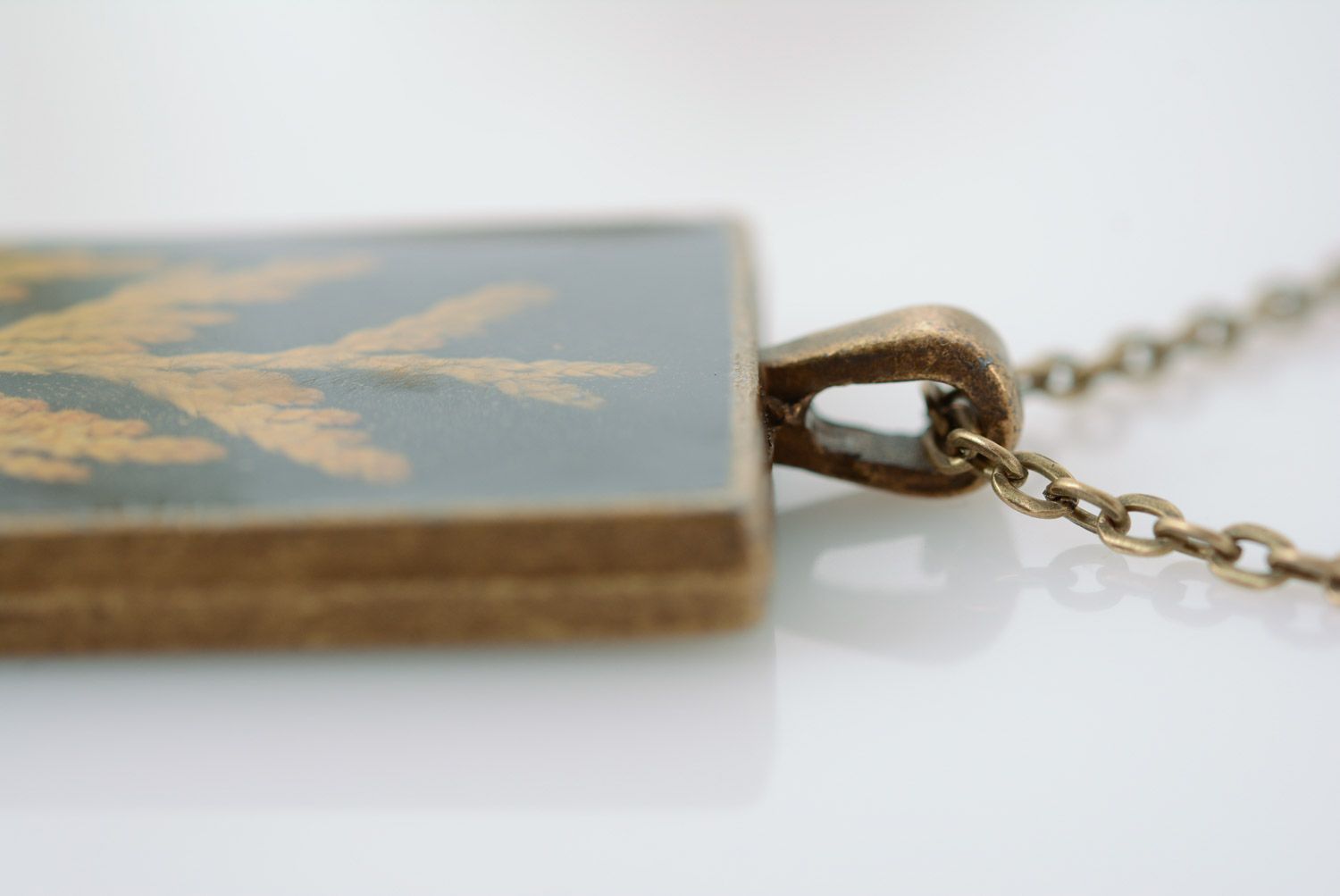 Handmade rectangular dark pendant with natural plants in epoxy resin on chain photo 3