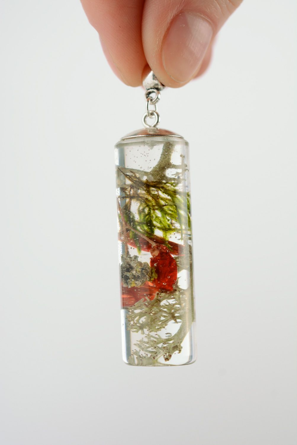Transparent handmade neck pendant with berries coated with epoxy resin photo 2