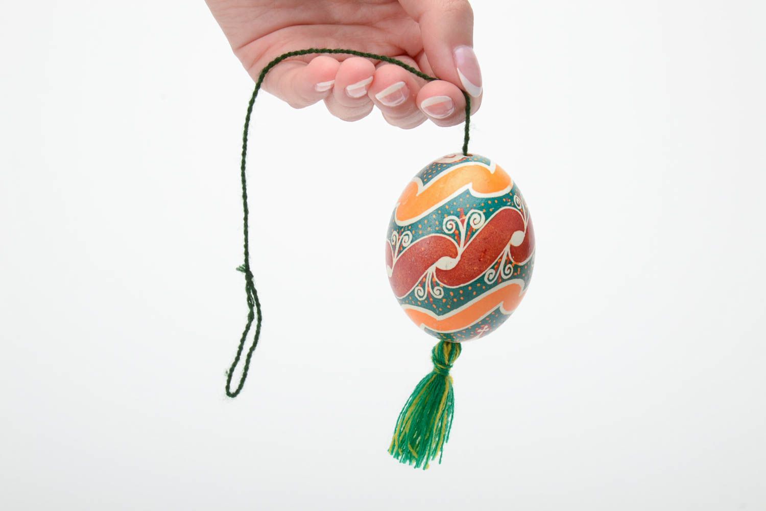 Handmade decorative colorful painted Easter egg pysanka with green tassel photo 5