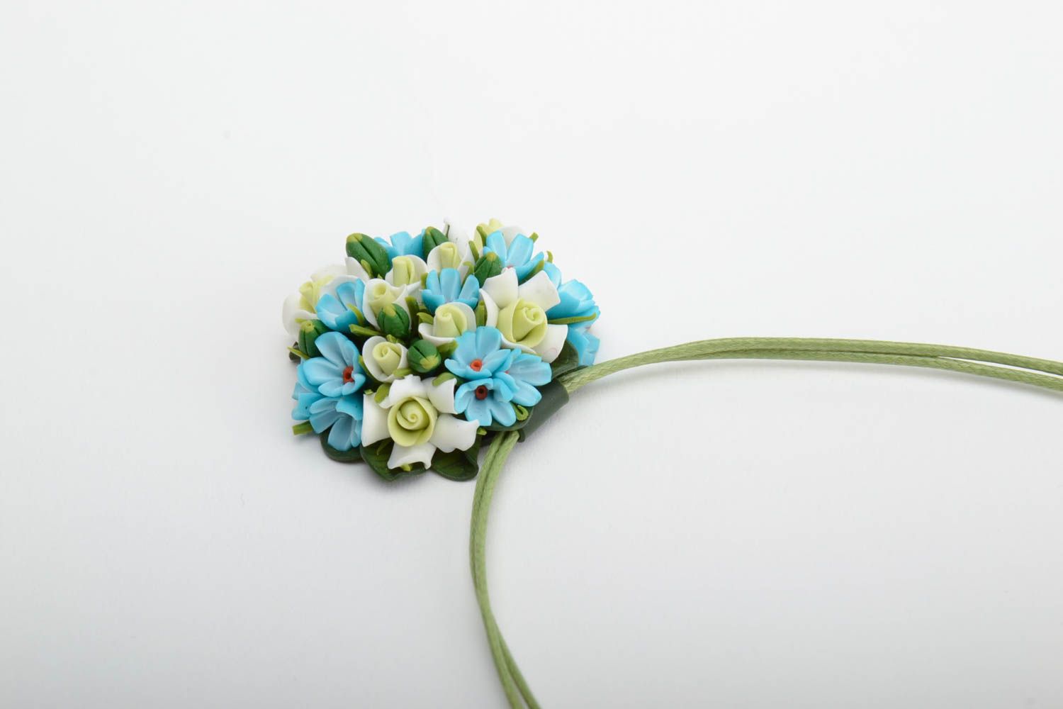 Handmade small round pendant necklace with blue polymer clay flowers on green cord photo 3