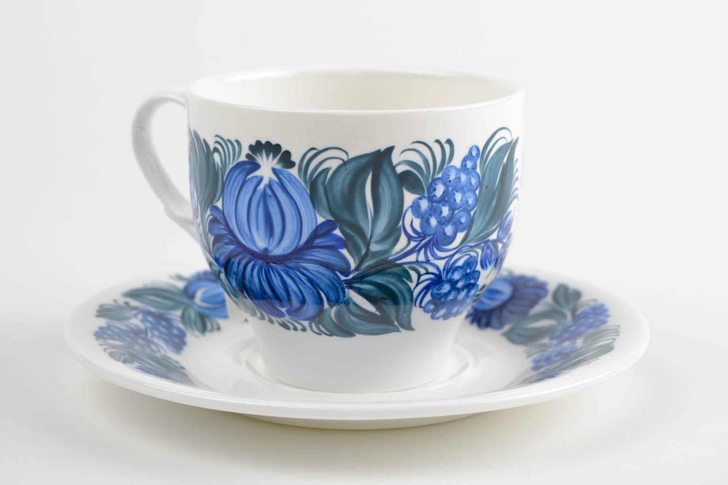 White porcelain cup with handle and saucer with blue floral pattern in Russian style photo 3