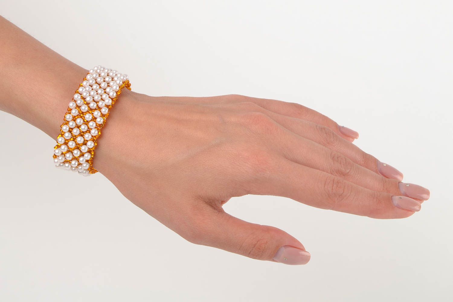 Handmade beaded wide bracelet in golden and white colors photo 2