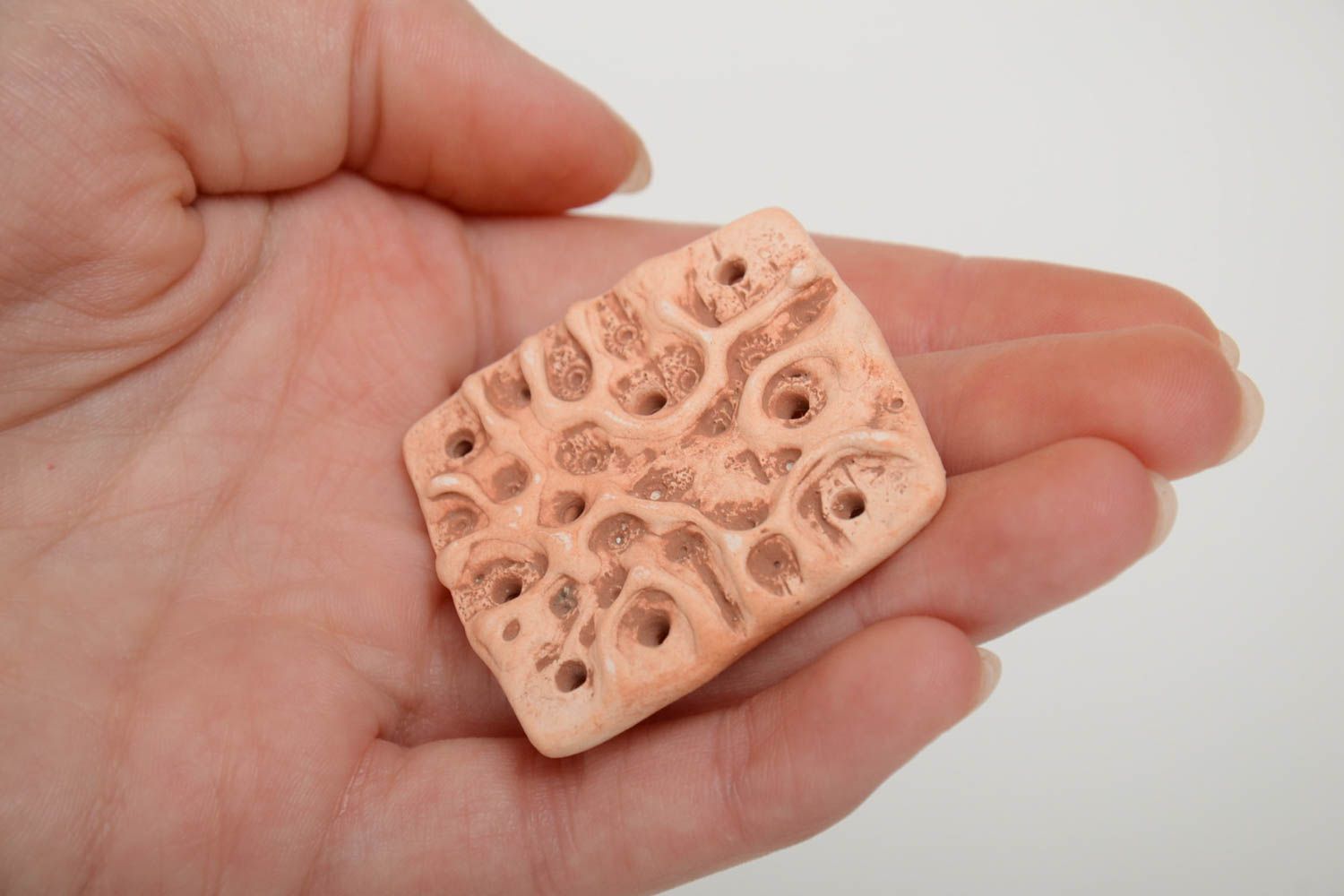 Handmade ceramic pendant of square shape molded of pottery clay with perforation photo 5