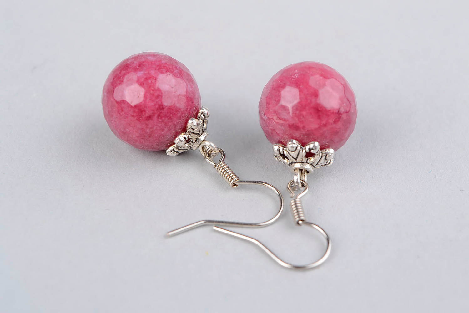 Ball earrings with a young ruby photo 2