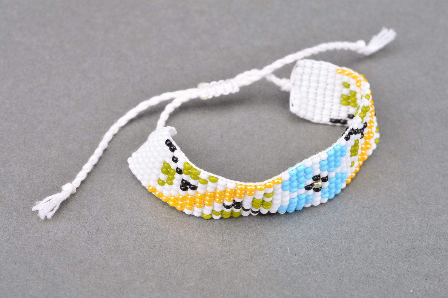 Handmade women's woven bead bracelet with ties White with Flowers photo 5
