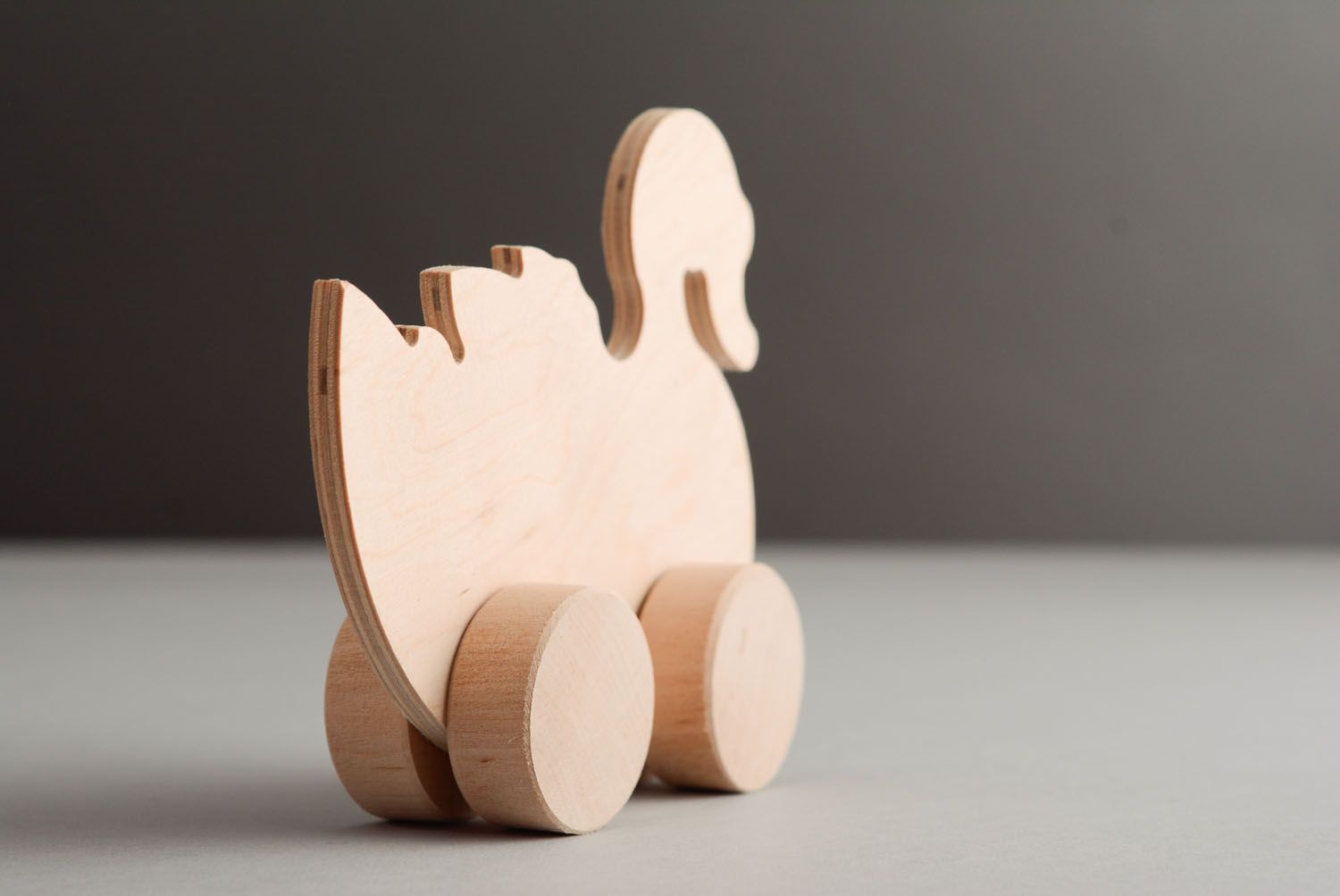 Wooden toy with wheels Swan photo 4