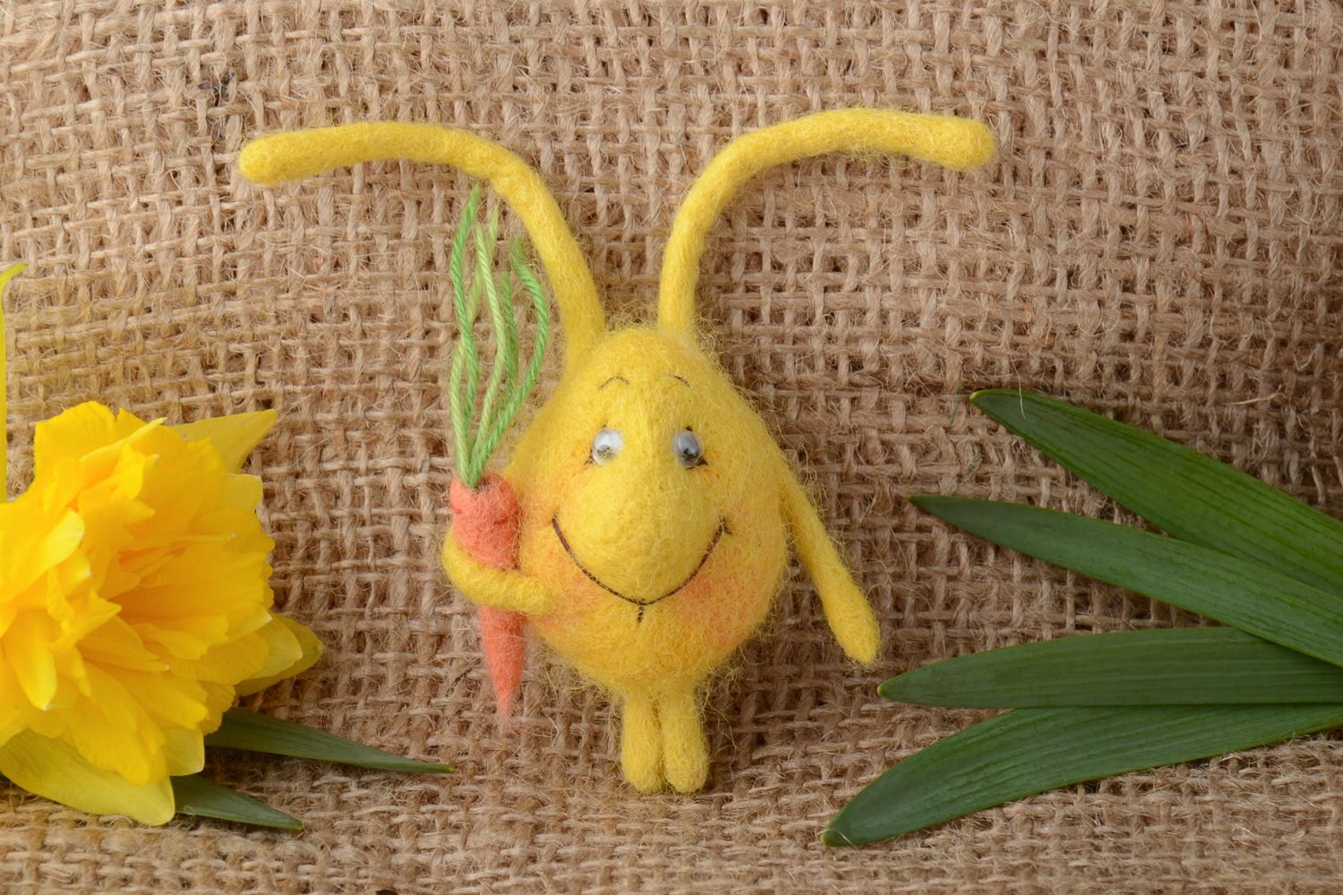 Small handmade brooch felted on natural wool in the shape of cute yellow rabbit photo 1