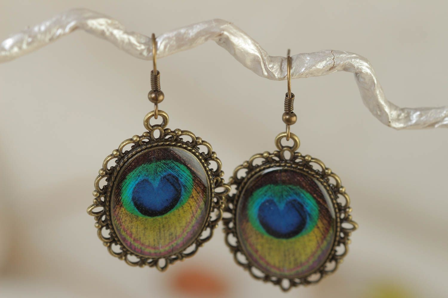 Beautiful handmade vintage oval earrings with peacock feathers drawing  photo 1