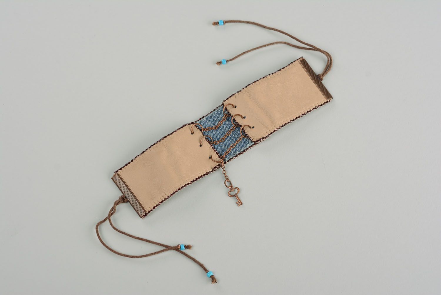 Leather bracelet with denim photo 1