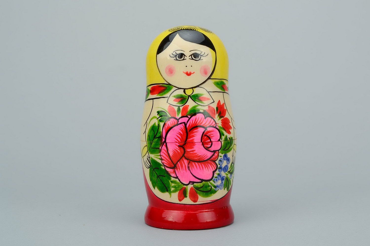 Painted wooden nesting doll of average size photo 4