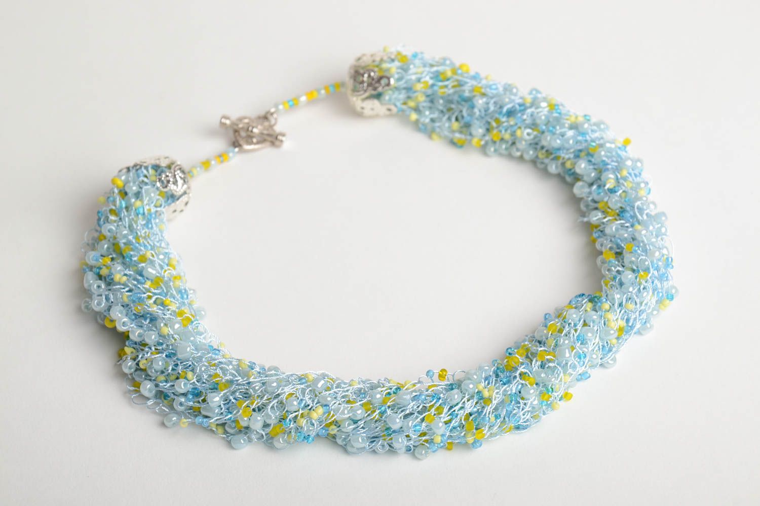 Handmade multi row airy necklace crocheted of beads in light blue color shades photo 3