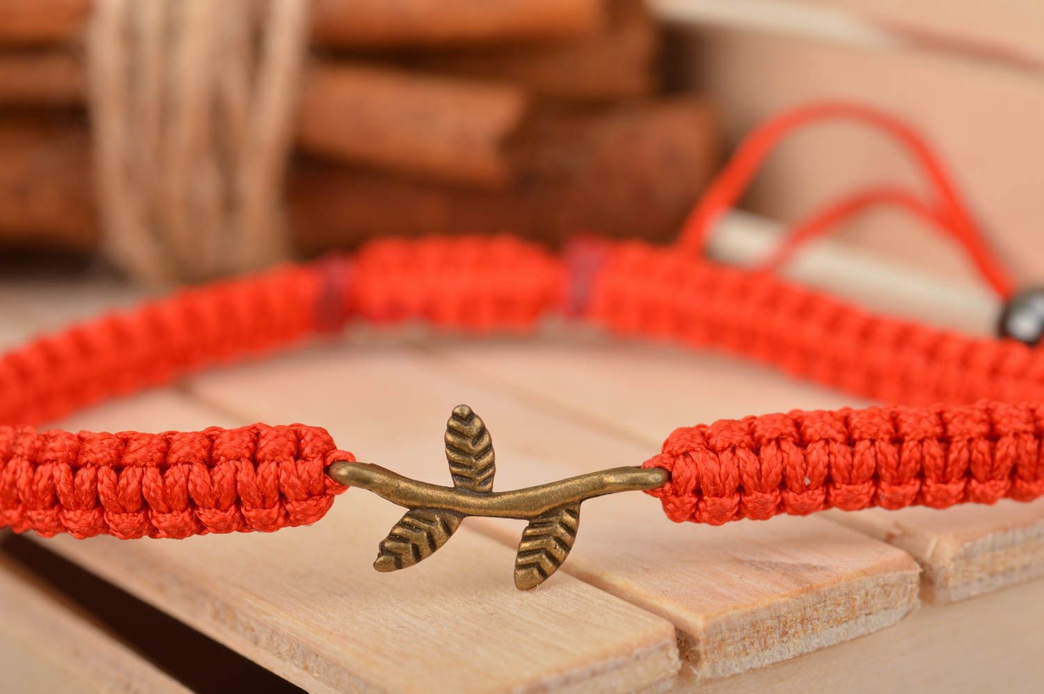 Handmade designer thin woven red bracelet made of silk threads with twig photo 1