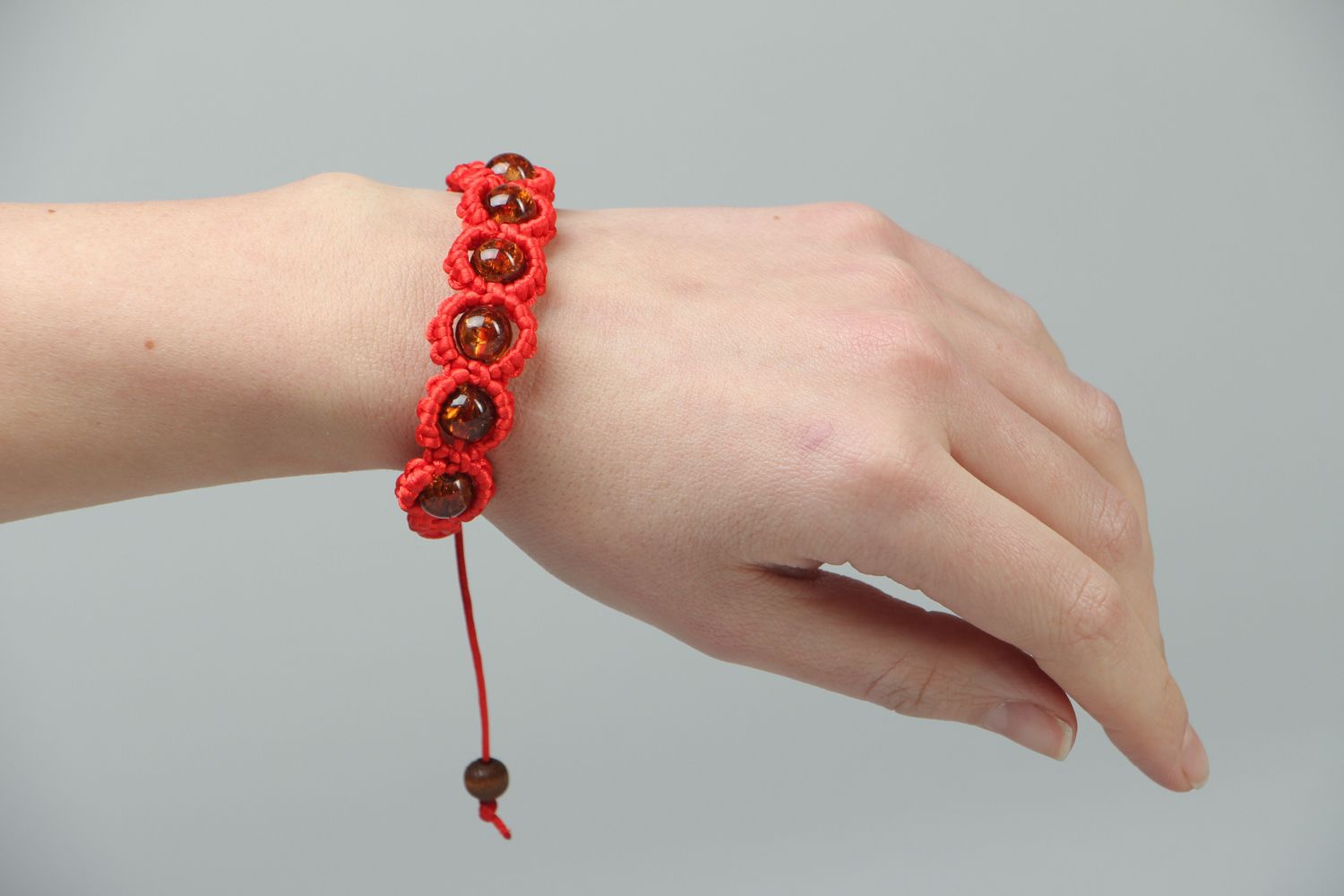 Red friendship bracelet with beads photo 3