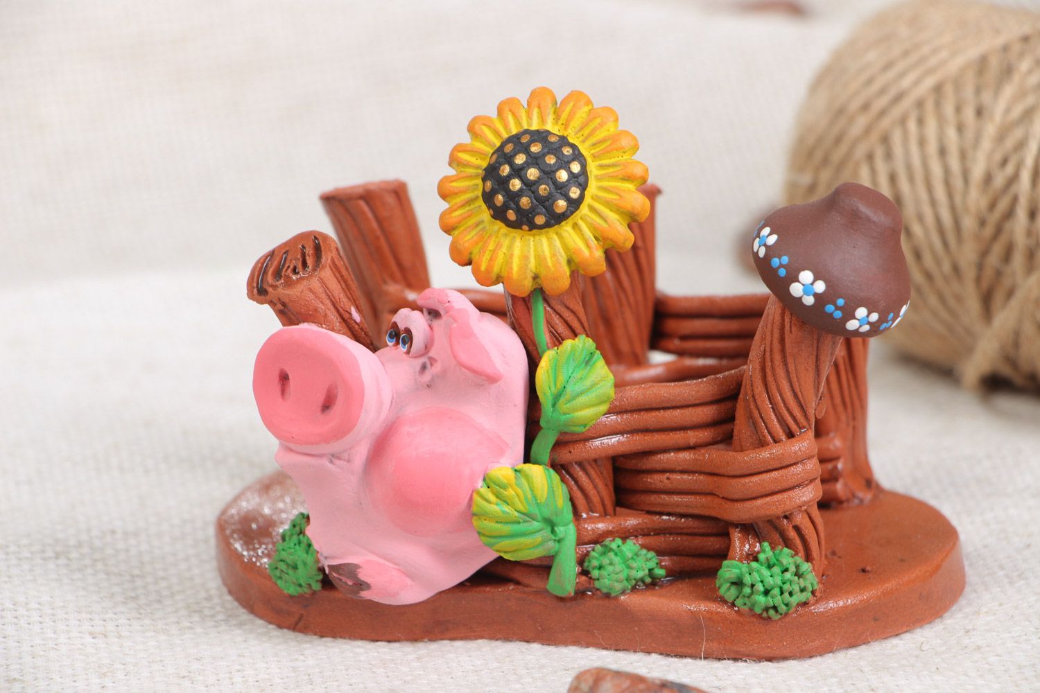 Handmade decorative ceramic napkin holder in the shape of a pig and a fence photo 1