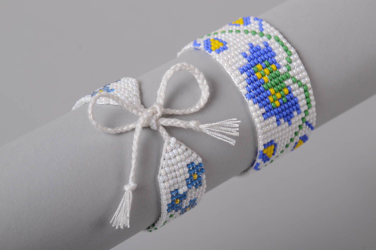 Strand beaded bracelet on a white rope with floral blue ornament set of two items photo 2