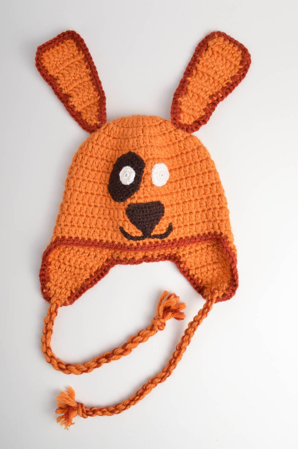 Оранжевая шапка из акрила и шерсти ручной работы на завязках для ребенка фото 3