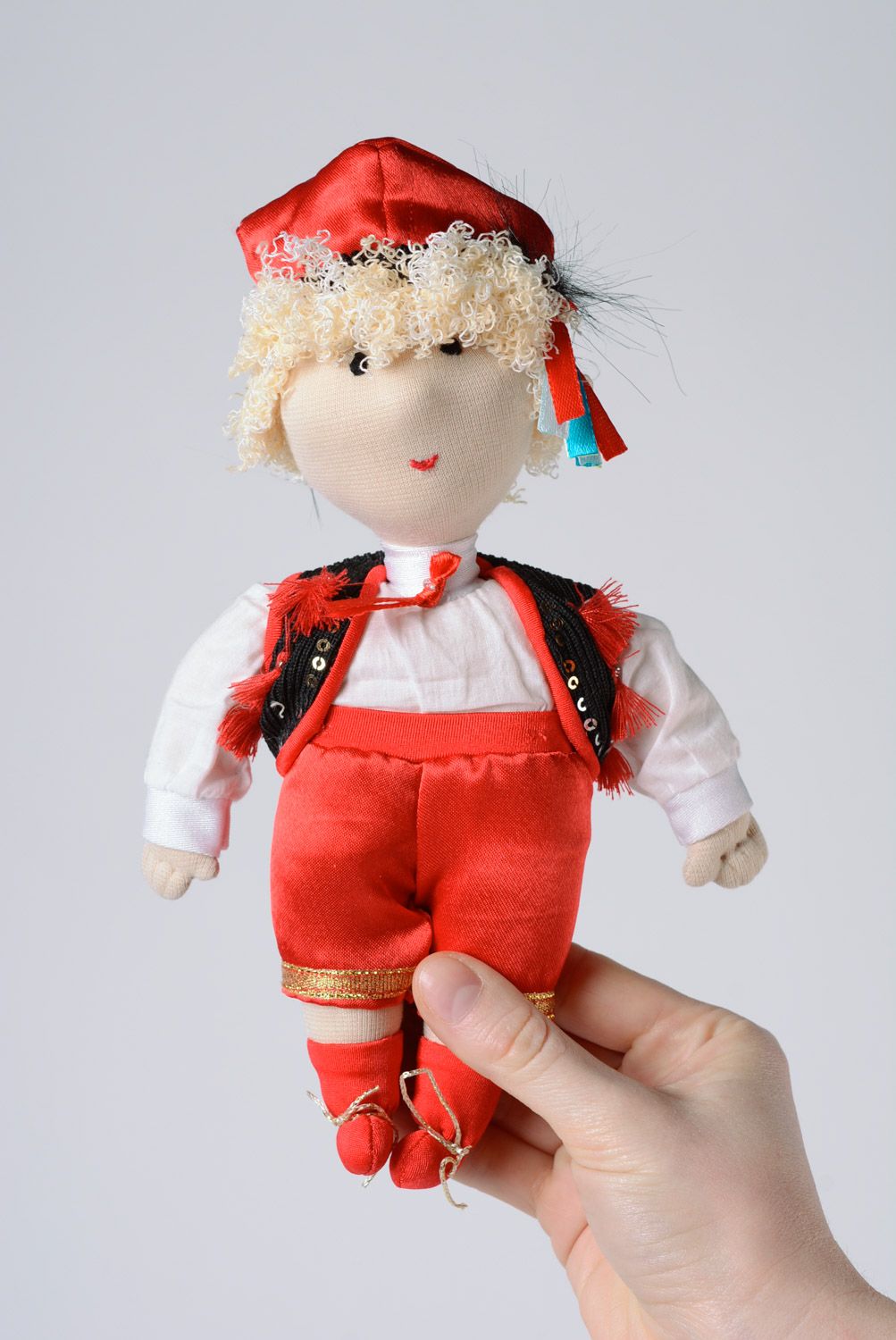 Handmade small soft toy sewn of fabric Polish boy in traditional costume  photo 1