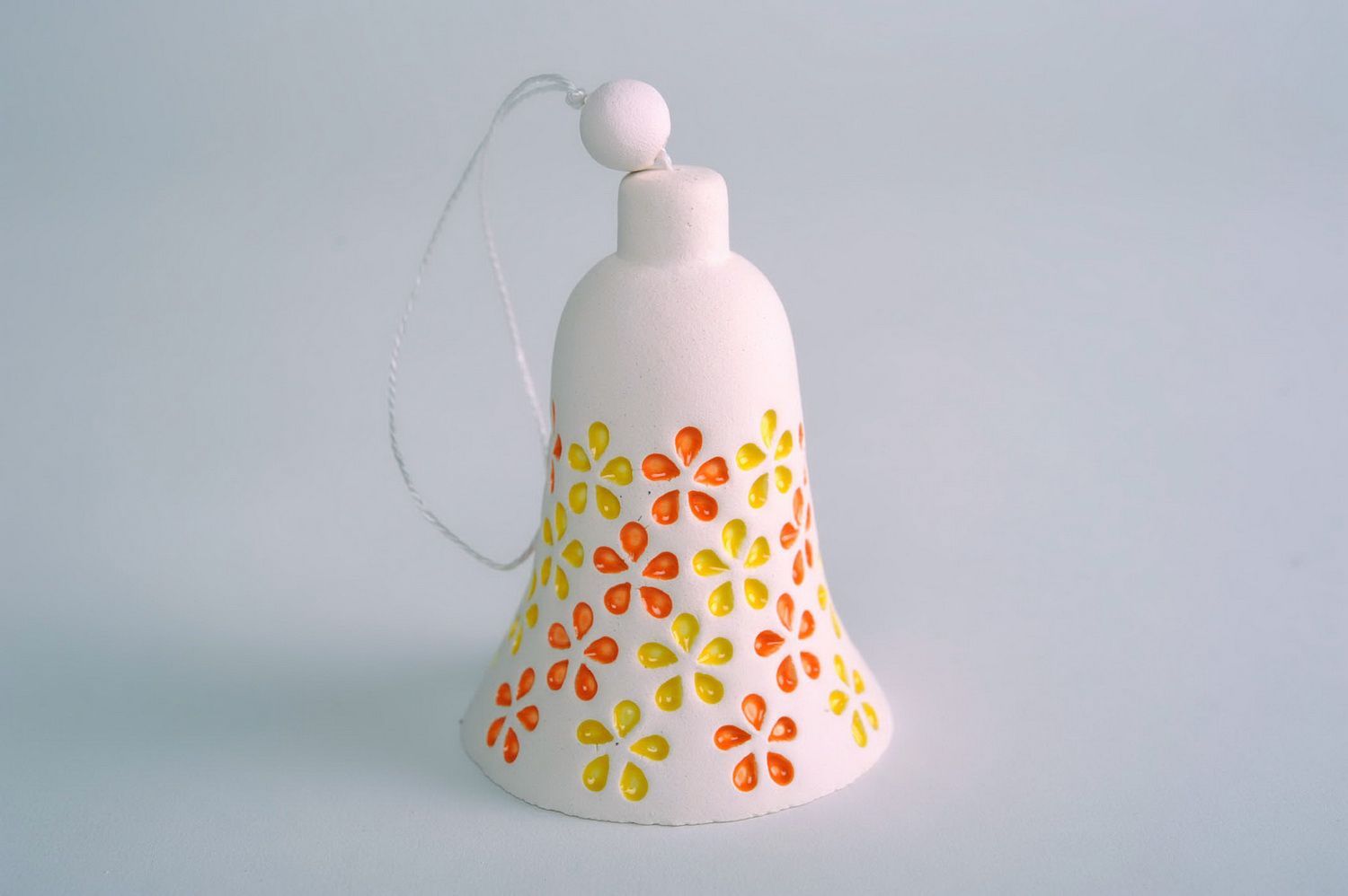 Ceramic bell made of clay photo 3