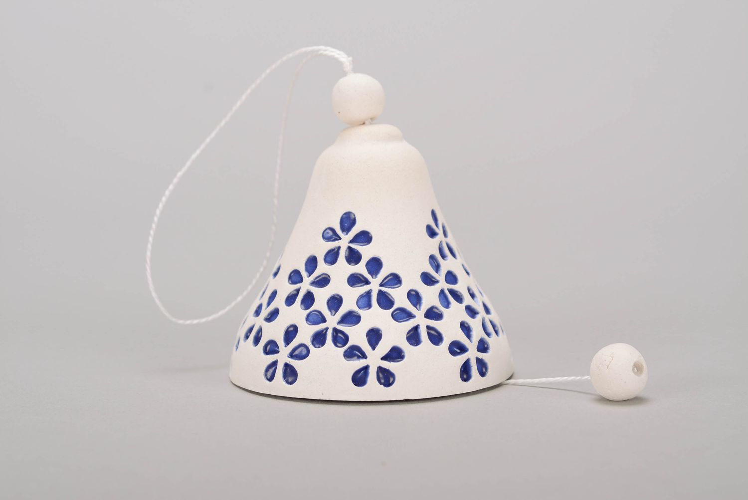 White clay bell covered with glaze photo 3