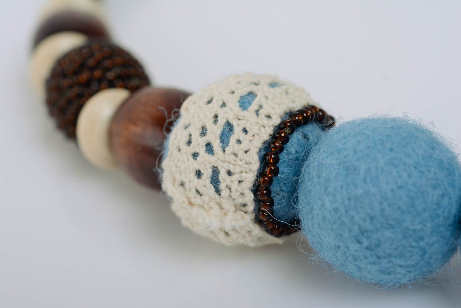 Handmade blue felted wool bead necklace with wooden beads and light lace photo 4