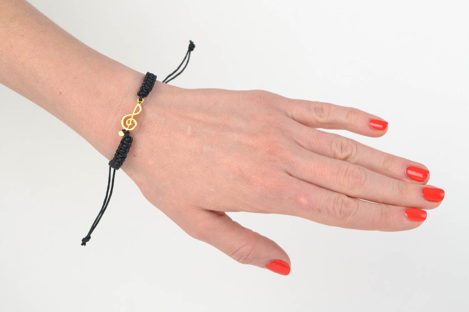 Handmade stylish bracelet made of cotton cord black with metal charm photo 2