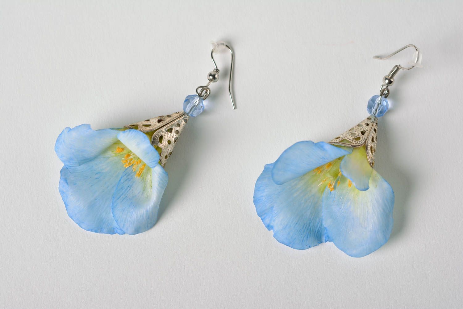 Homemade designer dangling earrings with blue flowers molded of polymer clay photo 2