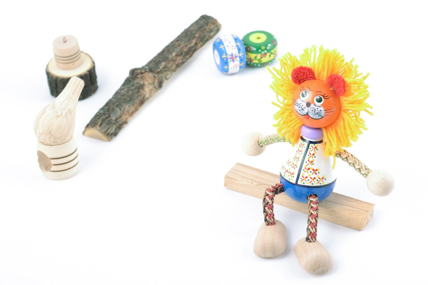 Designer small beech wood eco toy painted with natural dyes lion in ethnic suit photo 1